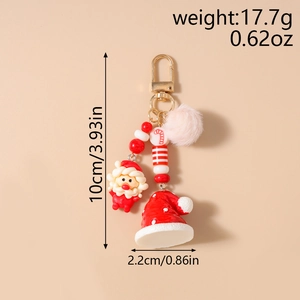 Detailed view of plush Santa keychain with dimensions and weight info displayed