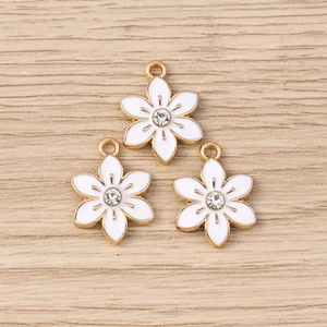 Fashionable golden flower charms with white enamel and rhinestone for DIY keychain making