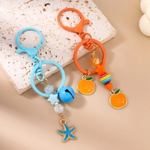 Porte-clés tendance perles étoile de mer et orange avec clochettes et fermoirs mousquetons