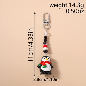 Détail du porte-clés pingouin perlé avec dimensions de 11cm et poids de 14,3g