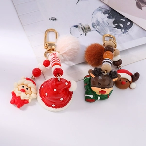 Christmas plush reindeer and Santa Claus keychain with colorful beads and faux fur pompom