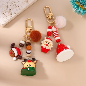 Plush Christmas reindeer and Santa Claus keychain set with colorful beads and gold clips