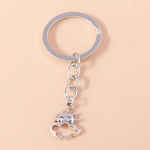 Detailed view of a silver-tone keychain with a smiling sun and cloud charm design