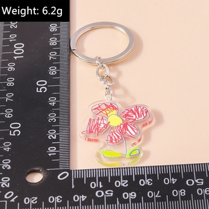 Detailed size view of a 6.2g acrylic flower keychain with red and yellow doodle pattern