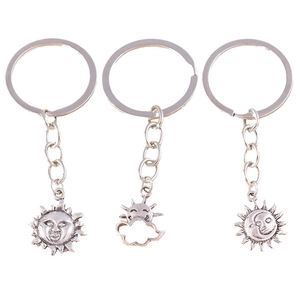 Vintage celestial keychain set featuring sun cloud and moon pendants in antique silver