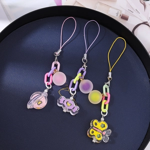 Candy colored keychain set with planet butterfly and heart pendants on acrylic chains