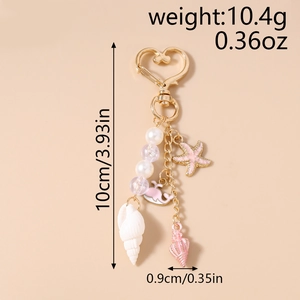 Detailed view showing ocean theme charms with starfish and whale for keychain bags