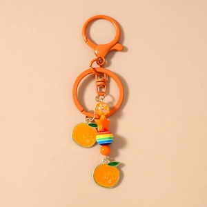 Détails du porte-clés clochette étoile de mer orange avec perles et breloques colorées