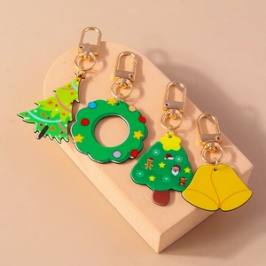 Christmas wreath and bell keychain set with festive tree pendants and golden metal clasps