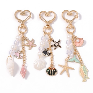 Fashion ocean themed keychain set with whale starfish shell charms and gold heart clasp