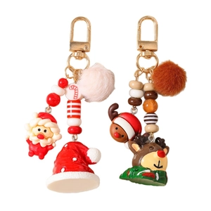 Christmas reindeer and Santa plush pompom keychains with golden hooks for bags