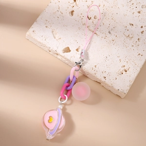 Detailed close-up of macaron pastel acrylic chain with planet and heart charms