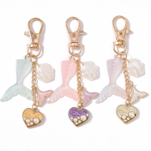 Mermaid tail keychain set with shell and pearl heart pendants in pastel macaron colors