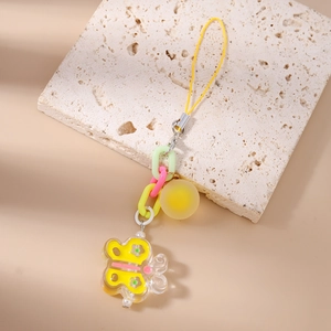 Detail of colorful acrylic butterfly charms on a chunky plastic chain for bags or phones