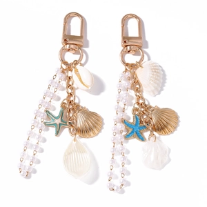 Coastal ocean shell and starfish keychain with pearl tassel and golden metal alloy finish