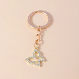 Porte-clés papillon ajouré en or rose élégant avec strass blancs étincelants