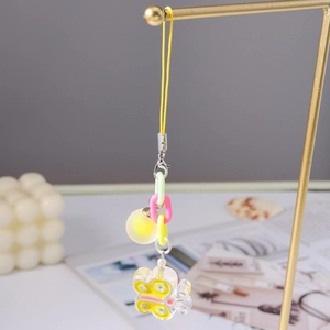 Detail of colorful acrylic butterfly bag charm with pastel plastic chain links