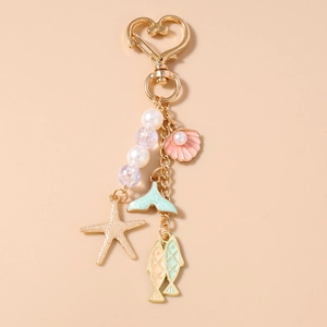 Detail of beaded marine keychain with golden heart clasp, shell, and starfish charms