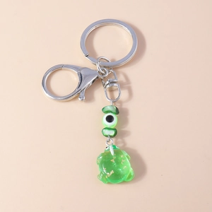 Green translucent resin frog keychain with gold foil flakes and unique eyeball bead