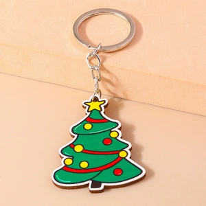 Detailed close-up of a green Christmas tree keychain with colorful baubles and a yellow star
