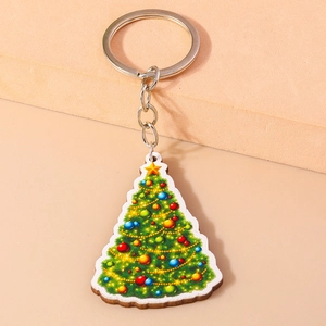Detail of the colorful Christmas tree wooden keychain with silver metal ring and chain