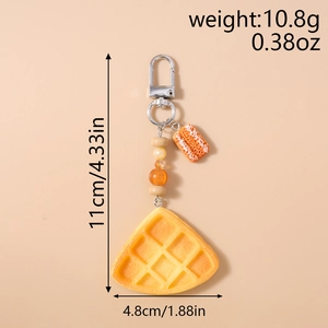 Detail showing waffle food keychain dimensions 11cm length and 4.8cm width measurements