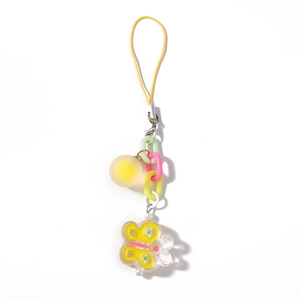 Detail of colorful resin chain charm with yellow butterfly pendant and round bead