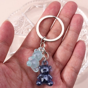 Fashionable skeleton bear keychain with translucent blue resin and blue plated metal charms