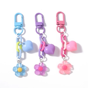 Three-pack colorful resin heart and cherry blossom keychains for bags and keys