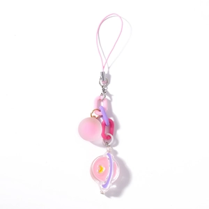 Pink and purple candy-colored planet keychain charm with star and heart details