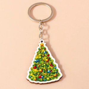 Macro detail of Christmas tree keychain with colorful baubles and silver metal ring