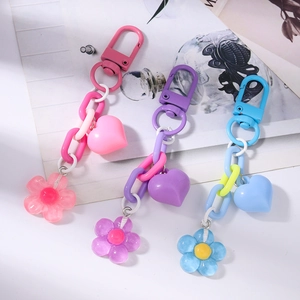 Cute cherry blossom and heart keychain pendants with candy colored chains in pink and blue