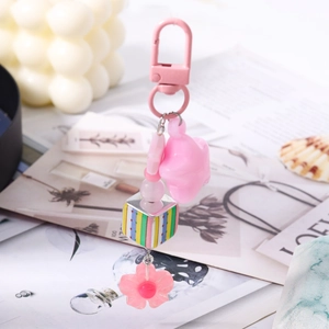 Pink floral bead keychain with star pendant and stripe cube charm for bags