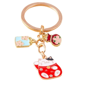 Japanischer Glückskatzen-Schlüsselanhänger mit goldenem Ring und Emaille-Glücksbeutel