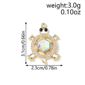 Detailed view of turtle pendant with hexagonal opal and small white rhinestones