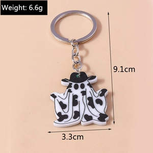 Porte-clés fantôme avec motif vache et chapeau noir, dimensions 9,1 cm par 3,3 cm