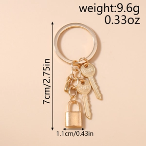 Close-up of golden LOVE letter key and lock pendants on a stylish alloy keychain