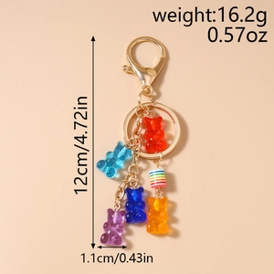 Detail view of colorful gummy bear charms with golden chain and weight dimensions