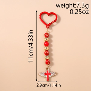 Detail view of red heart clasp beaded keychain with wing and cross pendant dimensions