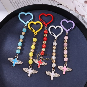 Cross wing beaded keychain set in blue, yellow, red, white, and pink finishes