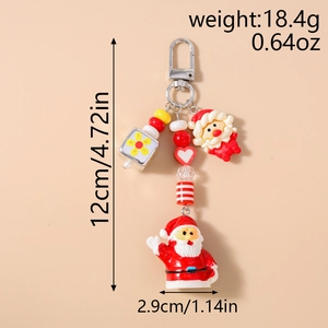 Vue détaillée du porte-clés Père Noël avec dimensions 12cm x 2,9cm et poids de 18,4g