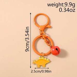 Detail view of cute orange stegosaurus keychain with bell and size dimensions in cm