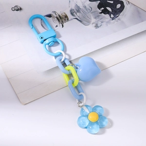Close-up of blue heart and cherry blossom charms with colorful plastic chain