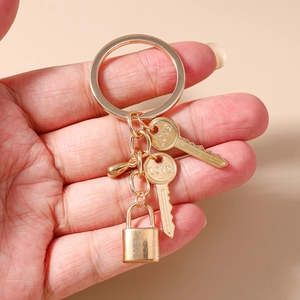 Golden alloy keychain featuring LOVE engraved keys and a rectangular padlock charm