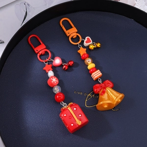 Porte-clés de Noël avec perles, clochettes et pendentifs boîte cadeau en rouge et or