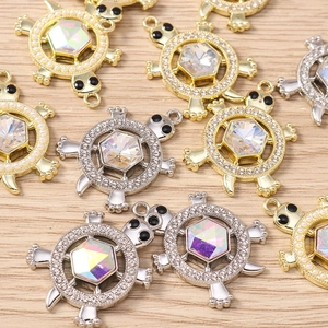 Detail of sea turtle pendants with aurora AB crystals and rhinestones for DIY jewelry