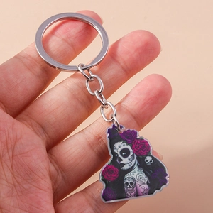 Cartoon Halloween acrylic keychain featuring Day of the Dead art with floral details