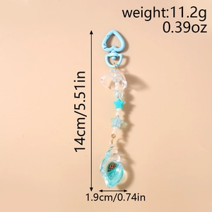 Detail of ocean-themed keychain with blue sea snail pendant and star beads