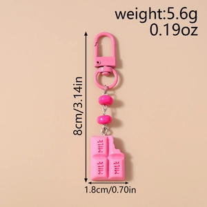 Detailed view of a pink chocolate milk charm with resin beads and dimensions