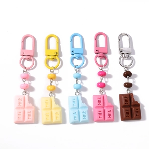 Five colorful simulation chocolate bar keychains with beads and lobster clasps
